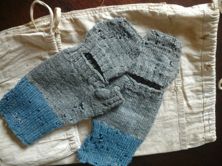 Blue and grey woollen mittens with flour bag
